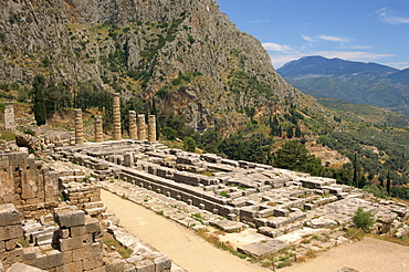 Ruins of the Temple of Apollo, with hills in the background, at Delphi, UNESCO World Heritage Site, Greece, Europe