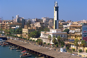 Waterfront skyline with lighthouse, Port Said, Egypt, North Africa, Africa