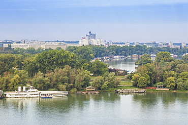 View of the confluence of the Sava and Danube rivers with Genex tower in distance, Belgrade, Serbia, Europe