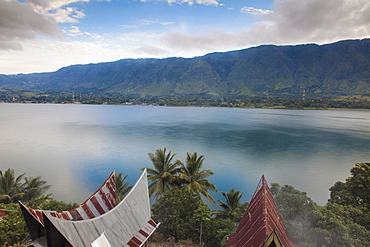 Typical Batak houses overlooking Lake Toba, Tuk Tuk, Lake Toba, Samosir Island, Sumatra, Indonesia, Southeast Asia, Asia