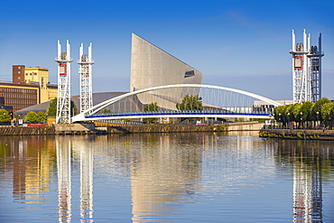 The Lowry footbridge and Imperial War Museum North, Salford Quays, Manchester, England, United Kingdom, Europe