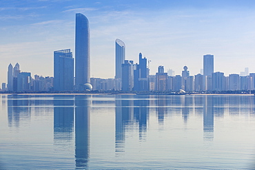 View of City skyline reflecting in Persian Gulf, Abu Dhabi, United Arab Emirates, Middle East