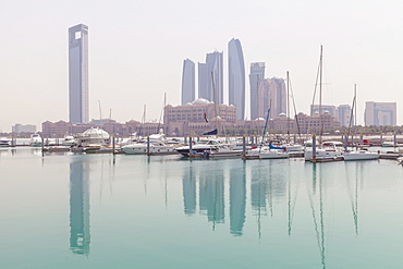 City skyline looking towards the Emirates Palace Hotel and Etihad Towers, Abu Dhabi, United Arab Emirates, Middle East