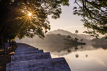 Sunrise at Kandy Lake and the island which houses the Royal Summer House, Kandy, UNESCO World Heritage Site, Central Province, Sri Lanka, Asia