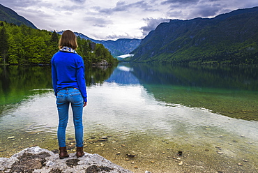 Tourist visiting Lake Bohinj, Triglav National Park, Julian Alps, Slovenia, Europe