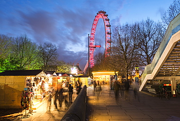 Christmas Market in Jubilee Gardens, with The London Eye at night, South Bank, London, England, United Kingdom, Europe