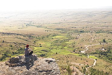 Tourist in Isalo National Park looking over Ihorombe Plains, Southwest Madagascar, Africa