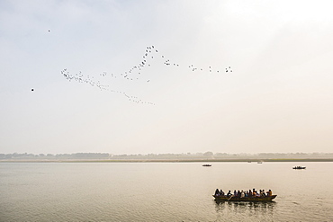 Pilgrims on a boat on the River Ganges, Varanasi, Uttar Pradesh, India, Asia