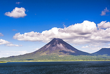 Arenal Volcano behind Laguna de Arenal (Arenal Lake), Alajuela Province, Costa Rica, Central America