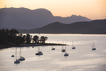 Sailing boats in Poros Island port at sunset, Saronic Island, Aegean Coast, Greek Islands, Greece, Europe