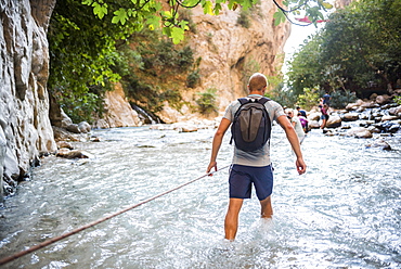 Tourist hiking in Saklikent Gorge, Saklikent National Park, Fethiye Province, Lycia, Anatolia, Turkey, Asia Minor, Eurasia