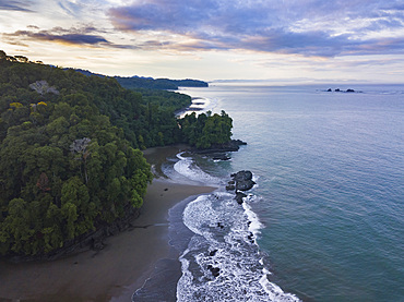 Drone view of Arco Beach and rainforest at sunrise, Uvita, Puntarenas Province, Pacific Coast of Costa Rica, Central America