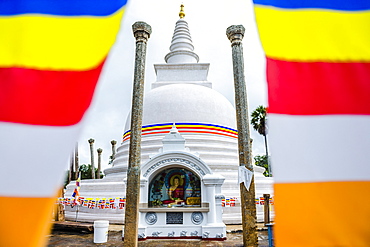 Thuparama Dagoba and the Buddhist flag, Ancient City of Anuradhapura, UNESCO World Heritage Site, Sri Lanka, Asia