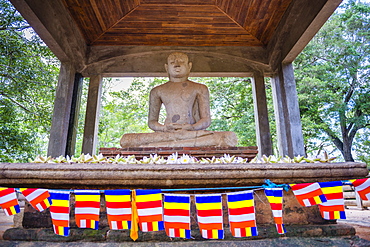 Samadhi Buddha statue and Buddhist flags, Anuradhapura, UNESCO World Heritage Site, Cultural Triangle, Sri Lanka, Asia