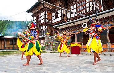 Bhutanese people performing the masked Cham Dance, Paro, Bhutan, Asia