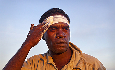 Aboriginal Yolngu man with tribal paint, often used when performing cultural dances and welcome ceremonies, Nyinyikay Homeland, East Arnhem LandNorthern Territory, Australia, Pacific