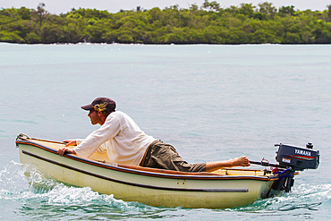 Unusual dinghy driving in the Galapagos Island Archipelago, UNESCO World Heritage Site, Ecuador, South America