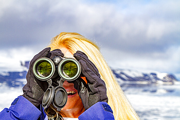 Staff from the Lindblad Expedition ship National Geographic Explorer (shown here is CT Ticknor) in the Svalbard Archipelago, Norway.