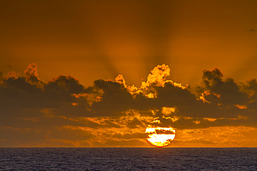 Sunset at sea near Nightingale Island, part of the Tristan da Cunha Group, South Atlantic Ocean