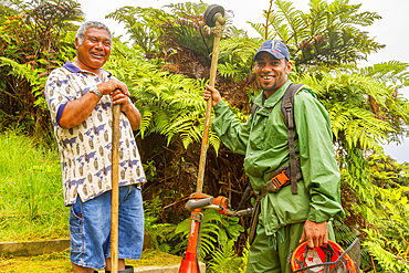 Portrait of two smiling men met on the trail of Diana's Peak National Park on Saint Helena, South Atlantic Ocean