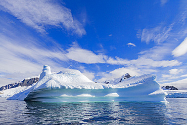 Iceberg in Lemaire Channel on the western side of the Antarctic Peninsula during the summer months, Southern Ocean.