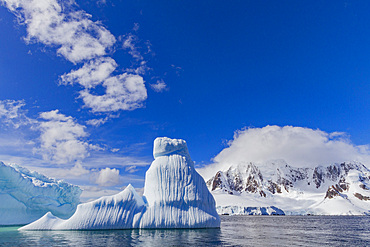 A view of icebergs in the Lemaire Channel on the west side of the Antarctic peninsula in Antarctica.