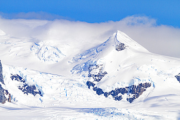 View of snow-capped mountains in Neko Harbor in Andvord Bay, Antarctica.