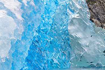 Glacial iceberg detail from ice calved off the Sawyer Glacier in Tracy Arm, Southeast Alaska, USA, Pacific Ocean.