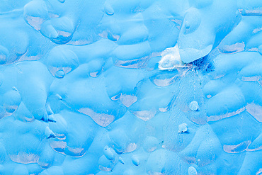 Glacial iceberg detail from ice calved off the Sawyer Glacier in Tracy Arm, Southeast Alaska, USA, Pacific Ocean.