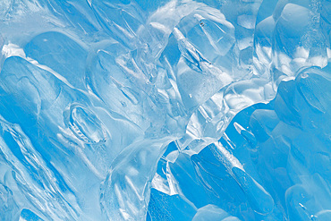 Glacial iceberg detail from ice calved off the Sawyer Glacier in Tracy Arm, Southeast Alaska, USA, Pacific Ocean.