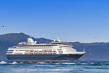 A view of various ships (shown here is the Holland America cruise ship Ryndam) in Southeast Alaska, USA, Pacific Ocean.