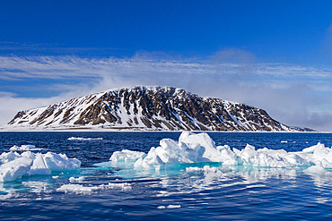 A view of ice-covered Phippsoya, the largest of the Sjuoyane Islands in the Svalbard Archipelago, Norway.