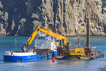 Dredging the harbor on remote Heimaey Island, Iceland.