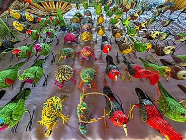Hand made wares on display for sale in a small village deep within the Pacaya Samiria Preserve, Peru.