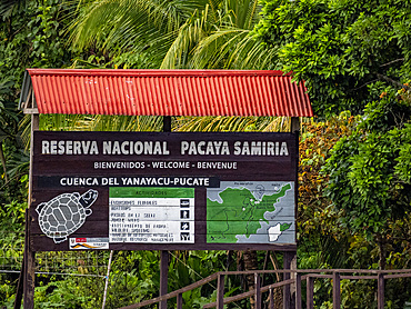 Local preserve signage in a national park deep within the Pacaya Samiria Preserve, Peru.