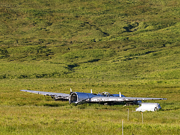 Wrecked and grounded B-24 Liberator bomber which ran out of fuel during WWII, Bechevin Bay, Atka Island, Alaska.