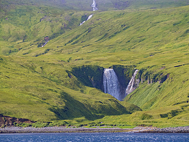 A waterfall on Kagamil Island. Kagamil Island is one of the four mountains of the Aleutian Archipelago, Alaska.