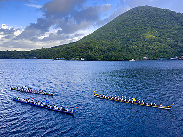 Groups of rowers coming out to greet our ship in the island of Banda Neira, Moluccas, Indonesia.