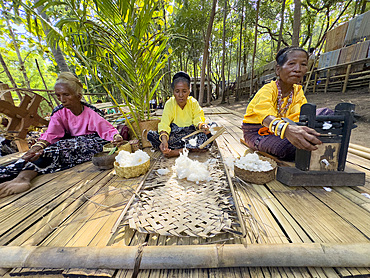 Women making thread for textiles in the village of Liangawo, on Flores Island, Lesser Sunda Islands, Indonesia.