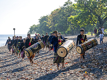 Ceremonial drummers coming to perform with their ornately painted drums on Sumbawa Island, Indonesia.