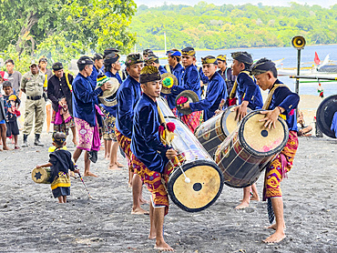 Ceremonial drummers coming to perform with their ornately painted drums on Sumbawa Island, Indonesia.
