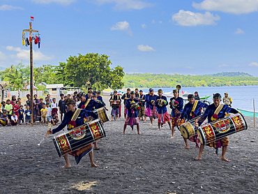 Ceremonial drummers coming to perform with their ornately painted drums on Sumbawa Island, Indonesia.