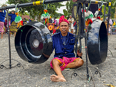 Ceremonial drummers coming to perform with their ornately painted drums on Sumbawa Island, Indonesia.