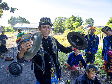 Ceremonial drummers coming to perform with their ornately painted drums on Sumbawa Island, Indonesia.