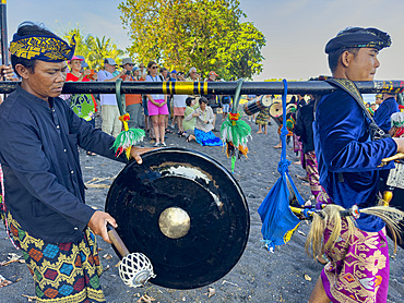 Ceremonial drummers coming to perform with their ornately painted drums on Sumbawa Island, Indonesia.