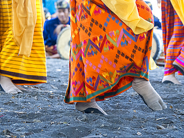 Young women in ceremonial regalia perform greeting ceremony on Sumbawa Island, Indonesia.