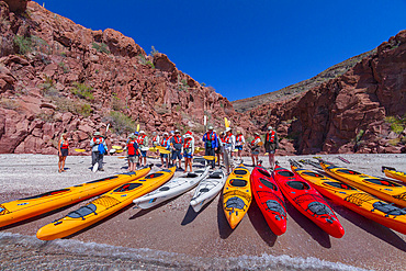 Tourists preparing to kayak at Isla Espiritu Santo in the lower Gulf of California, Baja California Sur, Mexico.