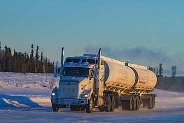 Heavy trucks on the ice road from Tibbitt to Contwoyto on the frozen Great Slave Lake, Northwest Territories, Canada.