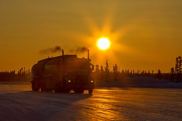 Heavy trucks on the ice road from Tibbitt to Contwoyto on the frozen Great Slave Lake, Northwest Territories, Canada.