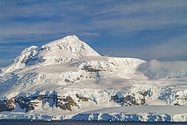 Snow-covered mountains in Crystal Sound, south of the Antarctic Circle, Antarctica, Southern Ocean.